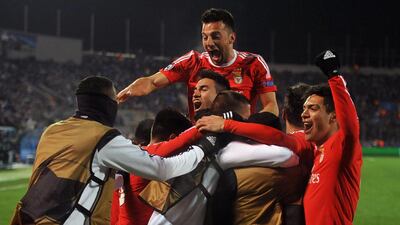 Benfica’s players celebrate a goal during the second-leg round of 16 UEFA Champions League football match FC Zenit vs SL Benfica at the Petrovsky stadium in St Petersburg on March 9, 2016. AFP PHOTO / OLGA MALTSEVA