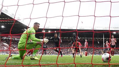 Shiefflied United's Dean Henderson, left, might have conceded a goal here against Liverpool at Anfield, back in September, but the Blades goalkeeper has enjoyed a fine season on loan from Manchester United. Getty