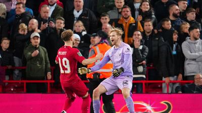 Liverpool goalkeeper Caoimhin Kelleher, right, celebrates with teammate Harvey Elliott after the English League Cup soccer match between Liverpool and Derby County, at Anfield Stadium, in Liverpool, England, Wednesday Nov. 9, 2022. (AP Photo / Jon Super)