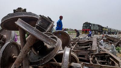 Damaged tracks are repaired a day after the derailment of a passenger train in Nawabshah, Pakistan. AFP
