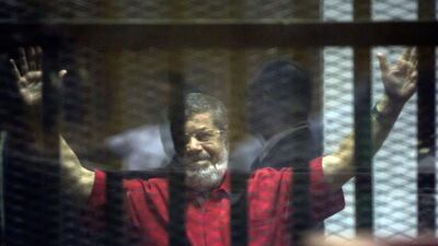 Former Egyptian president Mohammed Morsi in a defendants cage in a makeshift courtroom at the national police academy in an eastern suburb of Cairo on June 18, 2016. Amr Nabil / AP Photo
