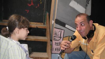Hossam Madhoun at a drama-therapy programme for children in Gaza. Courtesy Hossam Al Madhoun