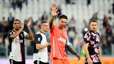 Juventus' Gianluigi Buffon, Danilo and Aaron Ramsey celebrate after the match. Reuters