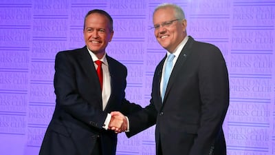 Australia's Labor leader Bill Shorten and Liberal leader and prime minister, Scott Morrison, shake hands at the start of "The Leaders' Debate" at the National Press Club of Australia in Canberra . AFP