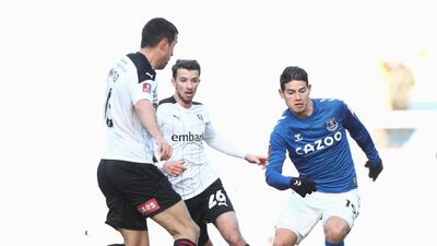 James Rodriguez closely watches by Rotherham's Richard Wood and Daniel Barlaser. Getty