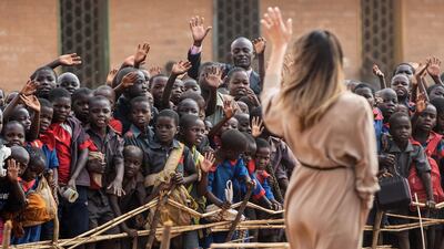 US First Lady Melania Trump waves to children at the Chipala Primary School in Lilongwe in Malawi. Saul Loeb / AFP