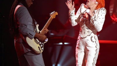 Nile Rodgers, left, and Lady Gaga perform a tribute to David Bowie at the 58th annual Grammy Awards. Matt Sayles / Invision / AP