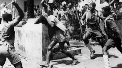 Government troops arrest a man suspected of being a liaison officer with foreign forces in Angola in 1961. ImageForum