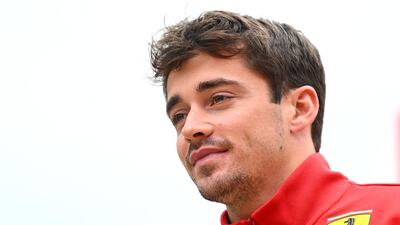 Ferrari's Charles Leclerc walks in the paddock. Getty