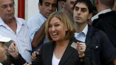 Tzipi Livni, the foreign minister of Israel, centre, arrives to cast her ballot at a polling station in Tel Aviv on Sept 17 2008. She declared victory today in the tight race for head of the Kadima Party.