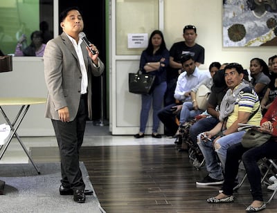 Phillipines Consul General Paul Cortes briefs amnesty seekers in Dubai. Satish Kumar for The National