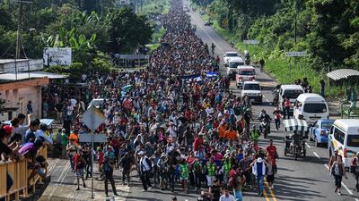 Honduran migrants take part in a caravan heading to the US on the road linking Ciudad Hidalgo and Tapachula, Mexico on October 21, 2018. AFP