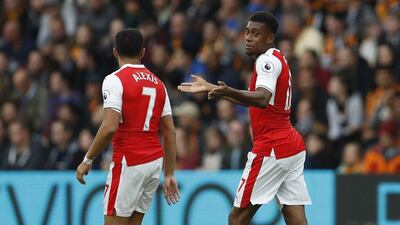 Arsenal’s Alexis Sanchez celebrates with Alex Iwobi after scoring their first goal. Lee Smith / Action Images / Reuters