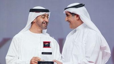 Mohammed Khalfan Al Rumaithi, right, receives an award from Sheikh Mohammed bin Zayed, Crown Prince of Abu Dhabi, in June.