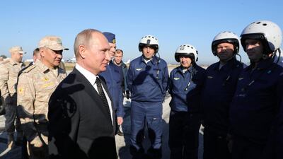 President Vladimir Putin meets with Russian servicemen at the Hmeimim air base in Syria's Latakia province on December 11, 2017. Michael Klimentyev / Pool / Kremlin / Sputnik / EPA