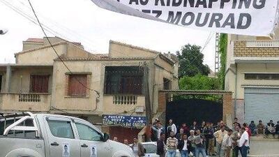 A car features a poster of Mourad Bilek, an 18-year-old youth who was kidnapped in May in the village of Beni-Douala in the northeastern Kabylie region of Algeria. Algerians went on strike and demonstrated in towns in the Kabylie region to protest against the kidnapping.