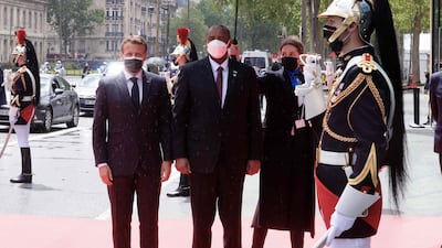 French President Emmanuel Macron welcomes Sudan's President Abdel Fattah Al-Burhan prior to an international conference on Sudan which aims to provide financing breathing room for its Prime Minister as he pursues economic reforms in Paris. AFP