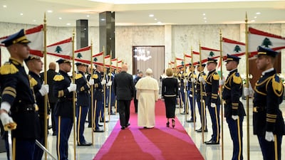 Pope Leo, President Aoun and his wife Neamat, the first Lady of Lebanon, review a guard of honour. EPA