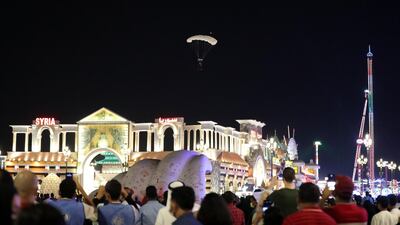 Global Village teamed up with Skydive Dubai, with 20 skydivers and 78 fireworks lighting up the sky. Chris Whiteoak / The National