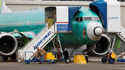 An employee works near a Boeing 737 Max aircraft at Boeing's 737 Max production facility in Renton, Washington. After hating production of the Max, the company is set to reassign workers to other programmes, including the 767 and 777/777X. Reuters.
