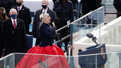 Lady Gaga and US Vice President Mike Pence during the national anthem at the inauguration of Joe Biden as the 46th President of the United States. Reuters