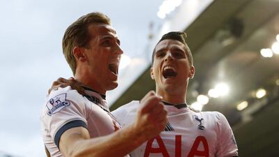 Harry Kane and Erik Lamela celebrate Tottenham’s first goal against Norwich on Saturday in the Premier League. Paul Childs / Action Images / Reuters