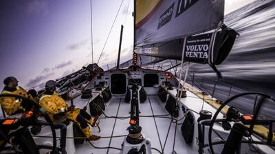 Abu Dhabi Ocean Racing sailors take a view of the sunset off the coast of Brazil during the first leg of the Volvo Ocean Race on Friday. Matt Knighton / Abu Dhabi Ocean Racing / Volvo Ocean Race / October 24, 2014