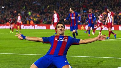 Luis Suarez celebrates after scoring. Alejandro Garcia / EPA