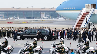 US president Donald Trump and first lady Melania Trump depart from the tarmac after their arrival at the Beijing Capital International Airport in China. Thomas Peter / EPA