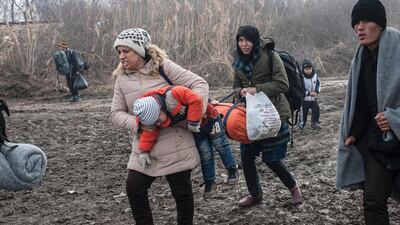 Refugees after crossing the Macedonian border into Serbia, near the village of Miratovac. Armend Nimani / AFP Photo