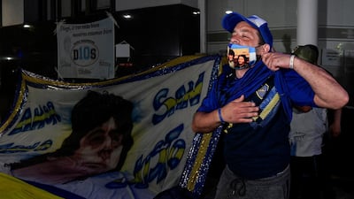 Supporters of Diego Maradona gather outside the hospital where he undergoes a brain surgery for a blood clot, in Olivos, Buenos Aires. AFP