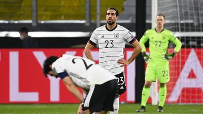 Germany midfielder Emre Can, Ilkay Gundogan and goalkeeper Marc-Andre Ter Stegen after conceding the second goal. AFP