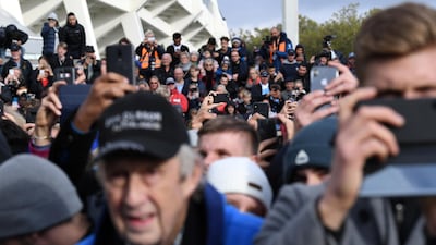 Fans take pictures during the unveiling of a the statue. Reuters