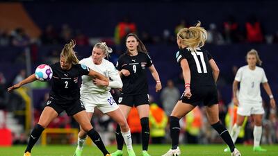 Austria's Marina Georgieva attempts to shield the ball from England's Alessia Russo. PA