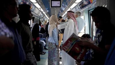 Dubai Metro commuters say trains are too crowded at peak times so more carriages and trains should be provided. Razan Alzayani / The National