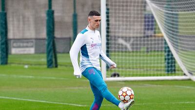 Phil Foden controls the ball during a Manchester City training session at the City Football Academy. PA