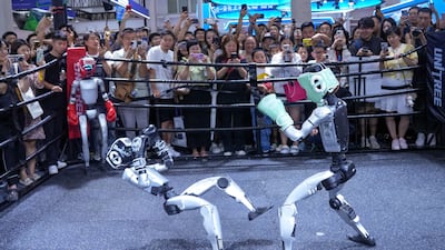 Robots fight at the Unitree Robotics booth during the World Robot Conference in Beijing. Reuters