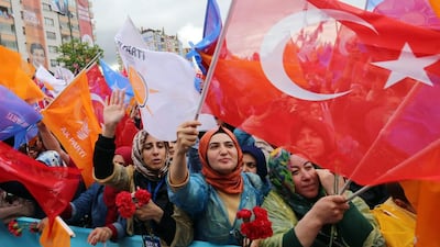 Supporters cheer Turkish prime minister Ahmet Davutoglu (not in the picture) as he addresses an election rally in Ankara. Burhan Ozbilici / AP Photo