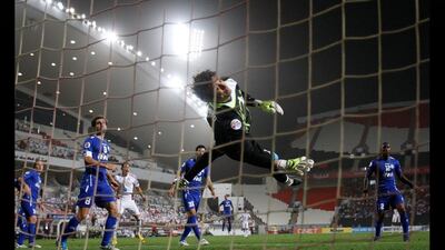 Iran's GK Mehdi Rahmati watches Al jazira's Ricardo De Oliveira's goal hit the net at the Mohammed bin Zayed stadium in Abu Dhabi. Mike Young / The National