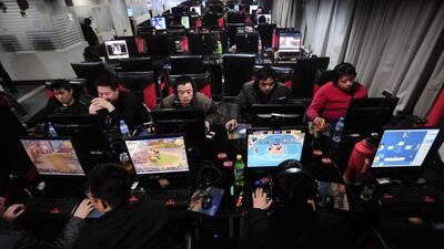 Customers use computers at an Internet cafe in Hefei, in central China's Anhui province. China has issued new regulations that expand its Internet controls. AP/ China Out