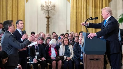 US President Donald Trump speaks with CNN reporter Jim Acosta during a press conference in the East Room of the White House. EPA