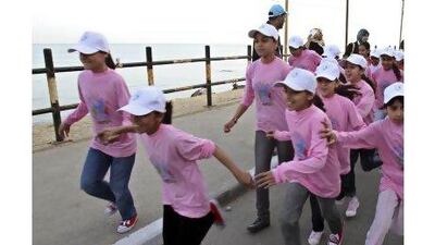 A reader objects to Hamas's decision to bar women from running in the Gaza marathon, in which many young girls participated in when the event was launched in 2011. Adel Hana / AP Photo