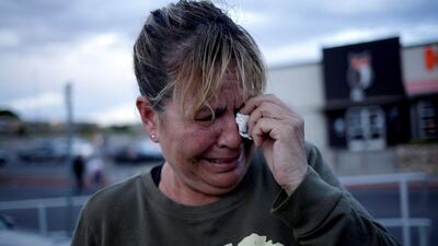A woman reacts after a mass shooting at a Walmart in El Paso, Texas. Reuters