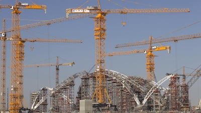 Above, the 180-metre arch span of the Midfield Terminal being built at the Abu Dhabi airport. Mona Al Marzooqi / The National