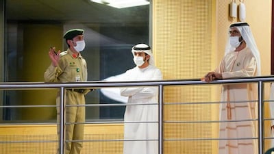 Sheikh Mohammed is given a tour by a Dubai Police official.