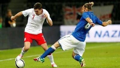 Manchester City's Adam Johnson, left, in action for England, is a target for Tottenham Hotspur.