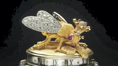 The Queen Bee watch for the Dowager Queen of Morocco is executed in textured 18K yellow gold, the body is decorated with canary yellow diamonds and the wings encrusted with white diamonds. The bee has ruby cabochon eyes, wears a multi-gem-encrusted crown and hovers over yellow and white pave diamond honey cells, by gemstone artist Andreas von Zadora-Gerlof
