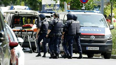 Policemen are seen in a street close to a school where, according to reports, several people died in a shooting, on June 10, 2025 in Graz, southeastern Austria. Several people died in a school shooting, including the attacker, Austrian broadcaster ORF quoted the interior ministry as saying. (Photo by ERWIN SCHERIAU / APA / AFP) / Austria OUT