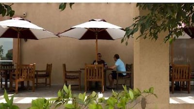 Residents Richard Buchanan, right, and Andy James enjoy a cup of coffee at Costa. Lee Hoagland / The National