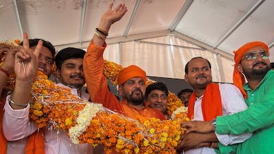 Brij Bhushan Sharan Singh, the chief of the Wrestling Federation of India, waves at his supporters during a political rally in Colonelgunj on June 11. Reuters